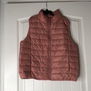 A cute pink sleeveless puffer vest for winter